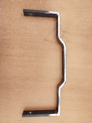 Držák krytu baterie